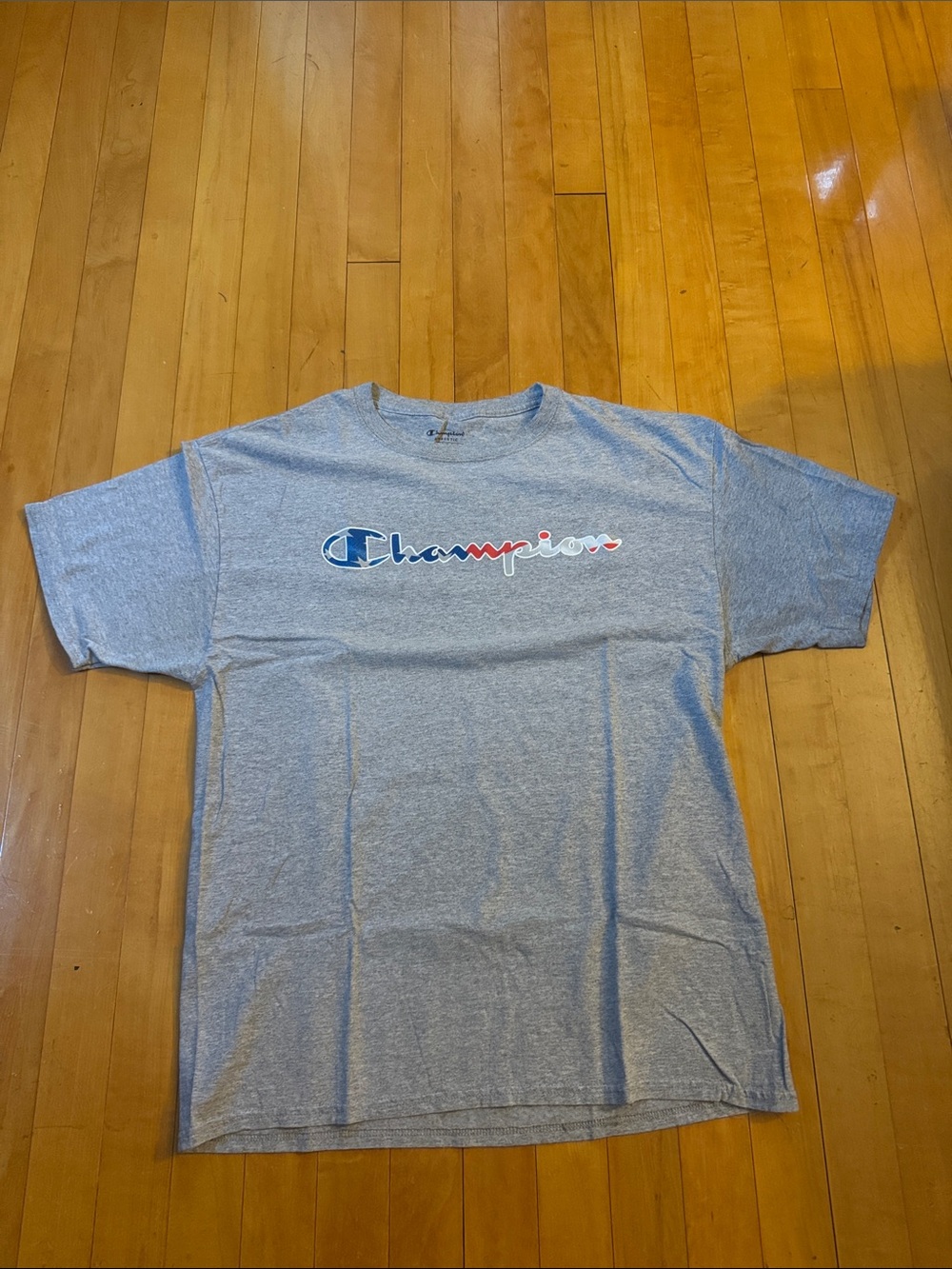 Champion Gray Short Sleeve Logo Tee with red,white,blue Patriotic script men’s L